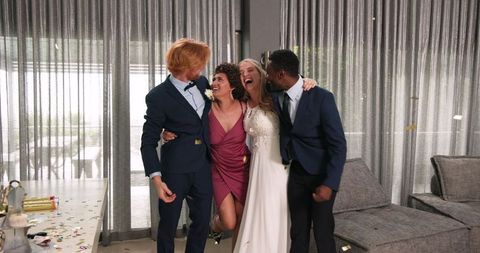 Joyful Wedding Celebration with Diverse Friends Embracing Happy Couple