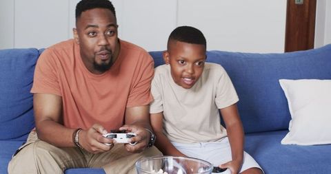 Father and Son Gaming Bonding Experience at Home