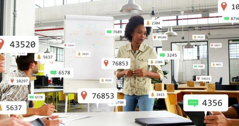 Presenting leader in modern open-plan office with digital engagement, analytics overlays