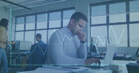 Business analyst evaluating growth data on laptop