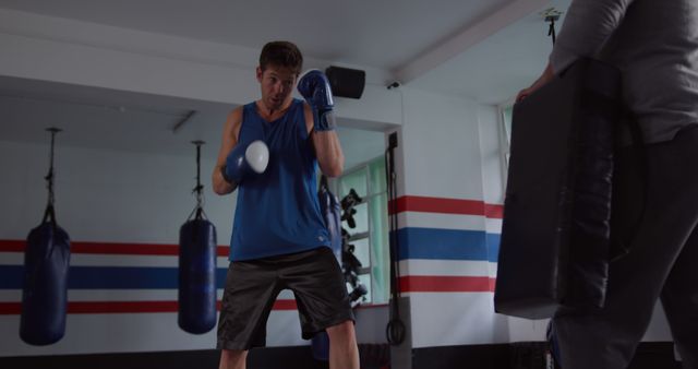 Male Boxer Practicing with Coach in Gym - Download Free Stock Images Pikwizard.com