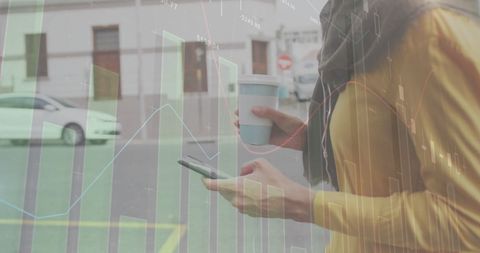 Woman with Phone Analyzing Data Graphs in Urban Environment