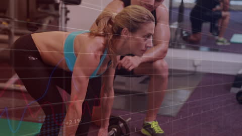 Couple Exercising in Gym with Fitness Data Overlay