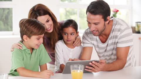 Happy Family Using Tablet in Modern Home