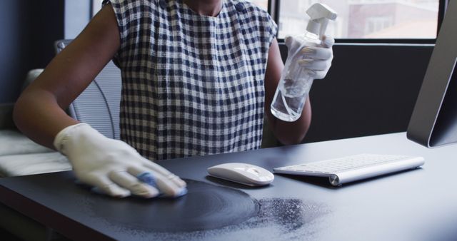 Person Cleaning Office Desk with Spray Bottle and Cloth - Download Free Stock Images Pikwizard.com