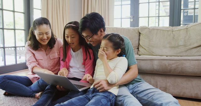 Happy Asian Family Using Laptop Together at Home - Download Free Stock Images Pikwizard.com