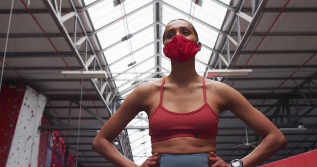 Confident Athlete in Mask Standing in Indoor Gym - Download Free Stock Images Pikwizard.com