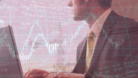 Caucasian Businessman Analyzing Stock Market Data on Laptop