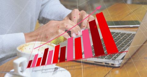 Business growth graph over person typing on laptop