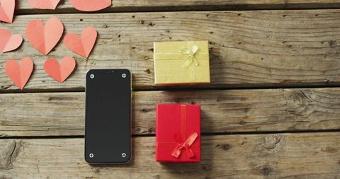 Valentine's Day Gifts with Hearts and Smartphone on Rustic Wooden Background - Download Free Stock Images Pikwizard.com