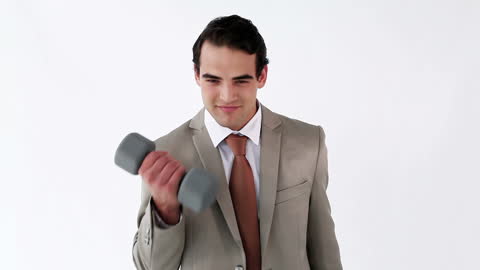 Confident Businessman Exercising with Dumbbell in Suit