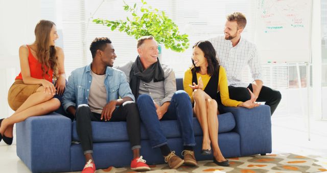 Diverse Professionals Enjoying Casual Meeting in Bright Office - Download Free Stock Images Pikwizard.com