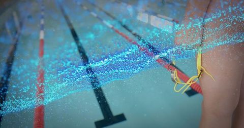 Swimmer with yellow swimsuit in competitive pool