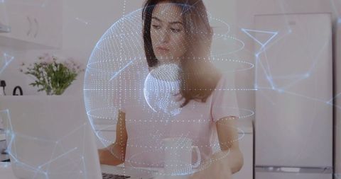 Woman Working on Laptop with Futuristic Digital Interface at Home