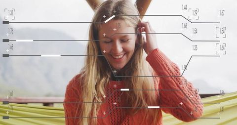 Woman enjoys mountain view with ar interface