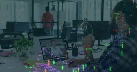 Watching remote presentation with financial data overlays in modern open office workspace