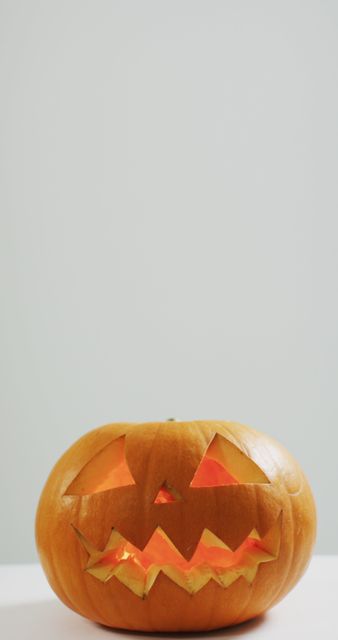 Festive Carved Halloween Pumpkin with Glowing Internal Light - Download Free Stock Images Pikwizard.com