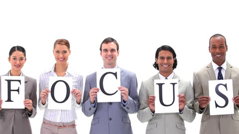 Diverse Professionals Holding Focus Letters in Business Attire