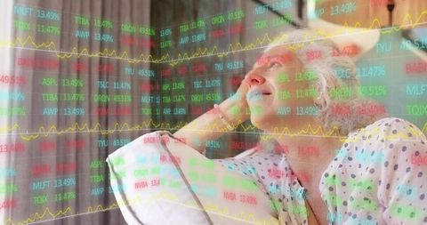 Senior woman relaxing on couch with stock market data overlay for retirement planning