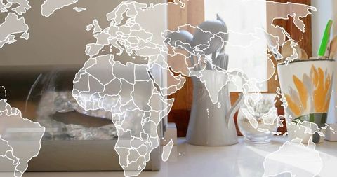Sunlit Kitchen Scene with White Pitcher, Floral Mug and Semi-Transparent World Map Overlay