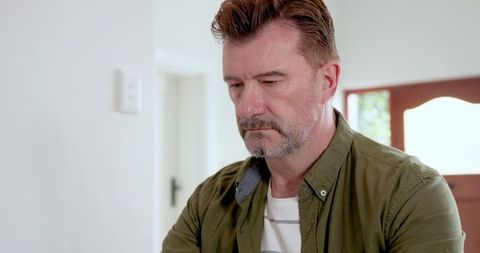 Thoughtful Man in Minimalist Home Interior