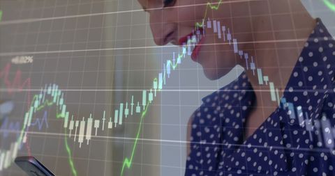 Businesswoman analyzing growth trends with smartphone