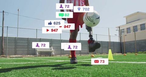 Athlete with prosthetic leg playing soccer on outdoor turf field