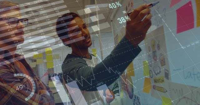 Diverse Team Working on Creative Project with Financial Data Overlay - Download Free Stock Images Pikwizard.com