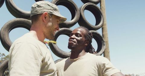 Diverse soldiers bonding after intense training session