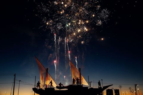 Spectacular Fireworks Display Over Event Silhouettes