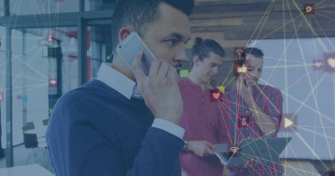 Businessman Discussing on Phone with Network Graphics Overlay