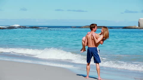Romantic Couple Enjoying Day on Sandy Beach Seaside