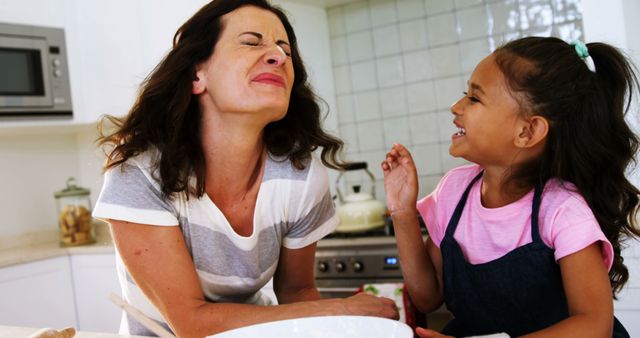 Mother and Daughter Enjoying Laughter in Modern Kitchen - Download Free Stock Images Pikwizard.com