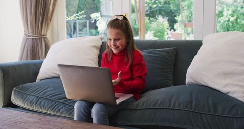 Smiling Girl Video Calling Family from Couch - Download Free Stock Images Pikwizard.com