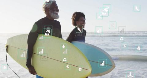 Joyful Mature Couple With Surfboards Enjoying Beach