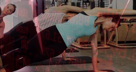 Women practicing side plank pose with overlay effect in gym
