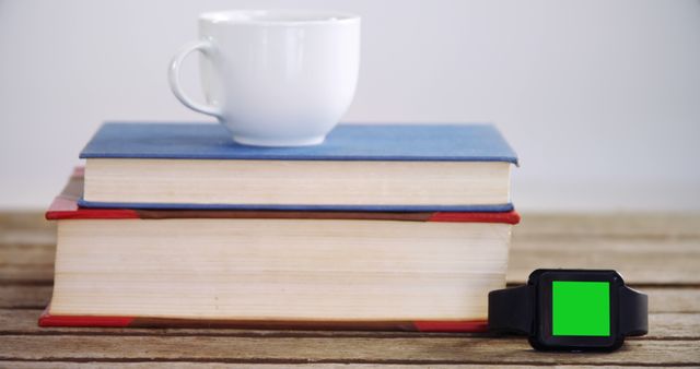 Smartwatch with Green Screen Next to Books and Coffee - Download Free Stock Images Pikwizard.com
