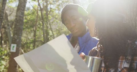 Diverse Couple Reading Map During Sunny Hike - Download Free Stock Images Pikwizard.com