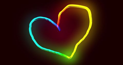 Colorful Neon Heart Glowing Against Black Background