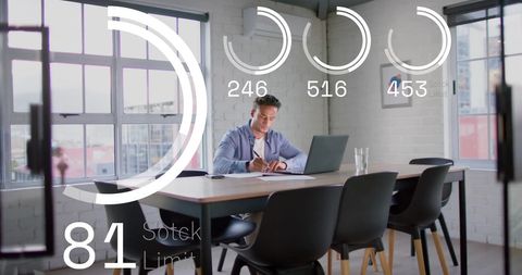 Latino Businessman Analyzes Financial Data in Modern Office