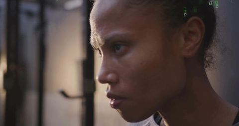 Breathing Heavily and Focusing Intently Female Athlete Training at Gym Squat Rack Close-Up