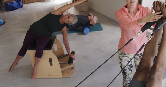 Senior Women Doing Pilates Exercises in Fitness Studio - Download Free Stock Images Pikwizard.com