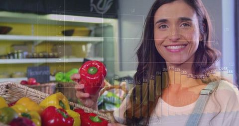 Smiling woman holding red bell pepper in farmers market with retail sales graph overlays