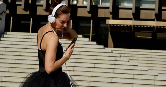 Ballet Dancer Wearing Headphones on Urban Steps - Download Free Stock Images Pikwizard.com