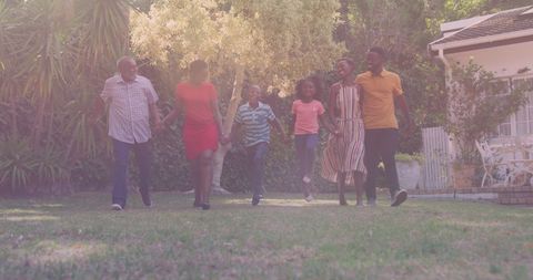 Diverse Family Enjoying Time Together Outdoor in Sunny Garden
