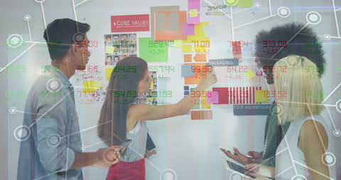 Diverse Team Analyzing Data and Financial Trends in Office