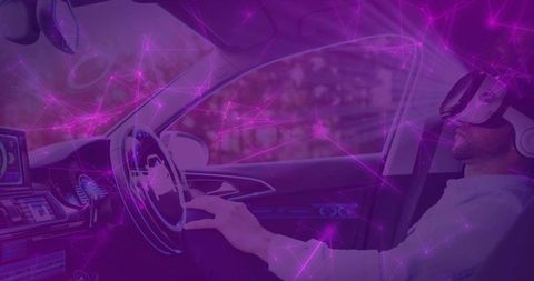 Driver wearing vr headset testing autonomous car controls with holographic network overlay