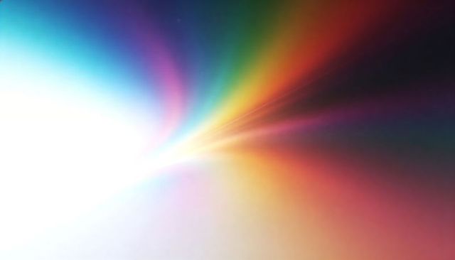 Radiant White Core Radiating Rainbow Light Rays and Abstract Spectral Glow Background