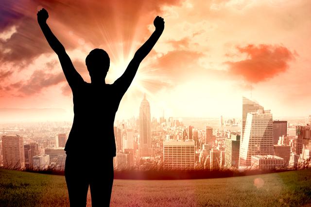 Silhouette of person raising arms in victory against an urban skyline at sunset. Perfect for inspirational and motivational content, presentations, advertisements, and posters highlighting themes of success, achievement, and triumph.