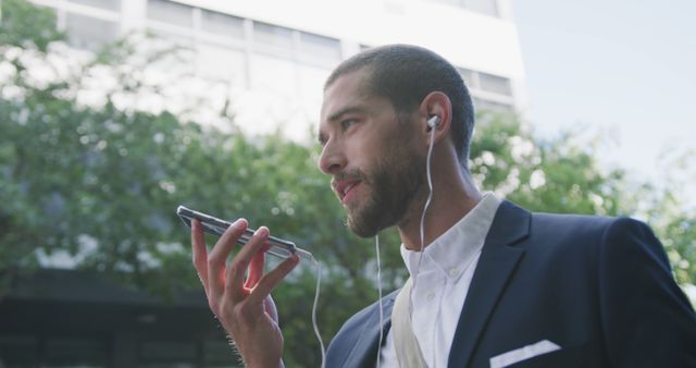 Businessman Talking on Phone Outside Office Building in Daylight - Download Free Stock Images Pikwizard.com